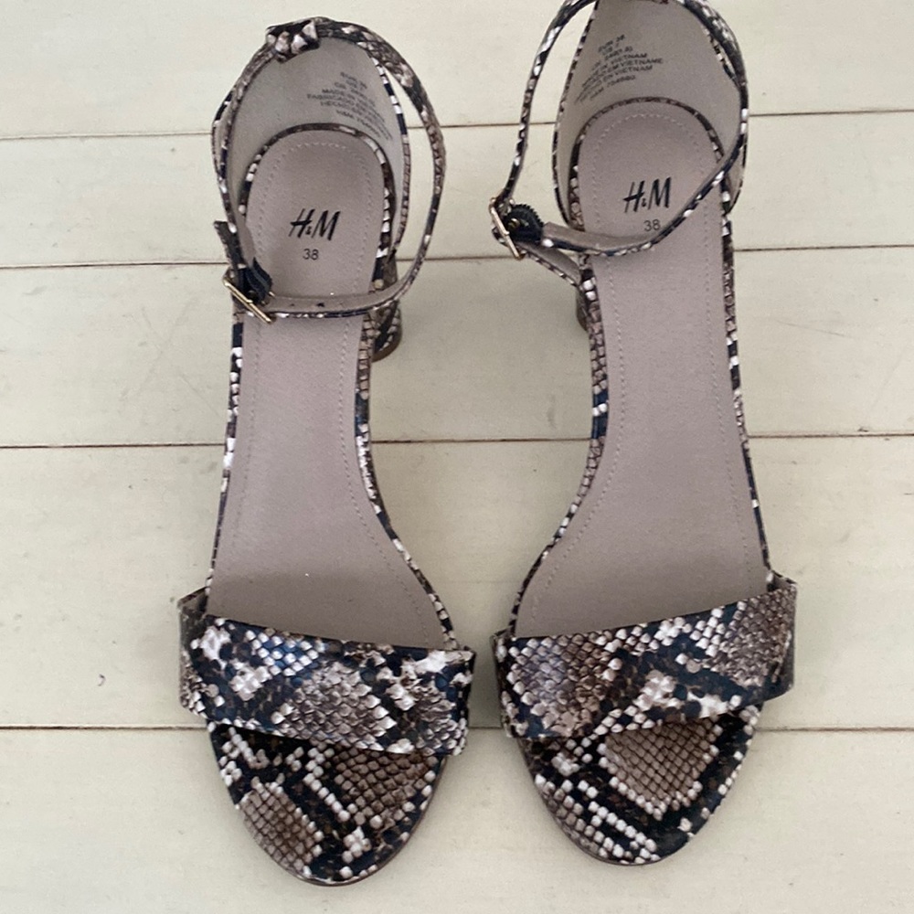 H & M ankle strap oval block heels in faux animal skin.